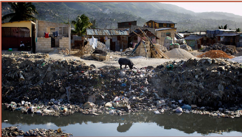 photo of plastic containers lining river bank in Haiti