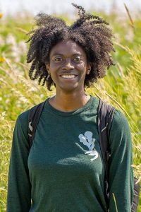 photo of Kayla Carter against wild grasses in a field